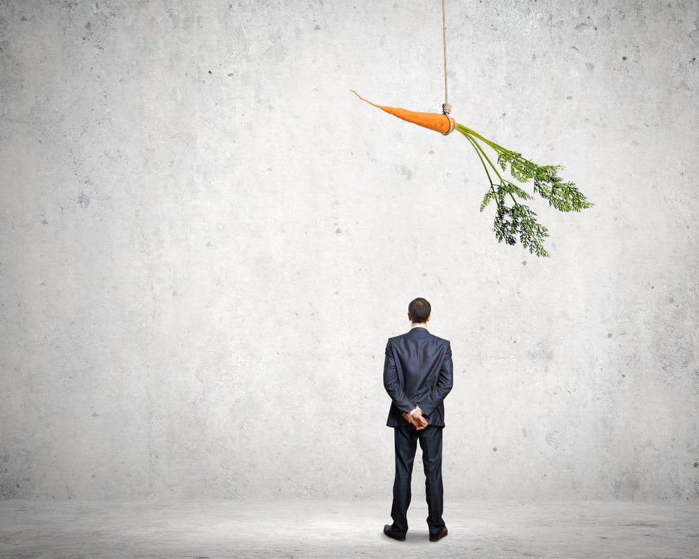 Funny image of businessman chased with carrot Funny image of businessman chased with carrot